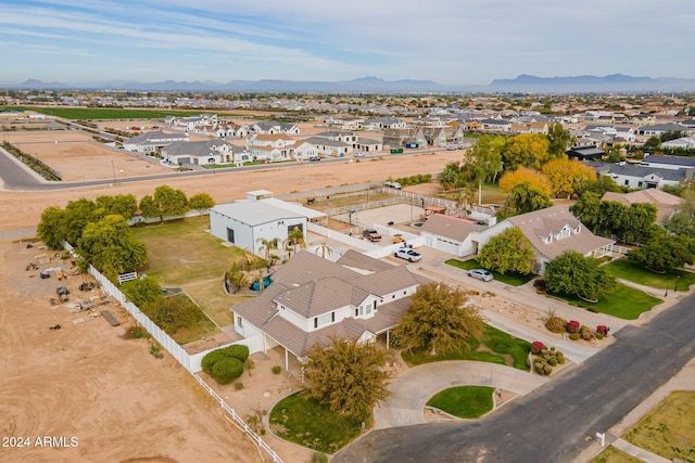 birds eye view of property with a mountain view