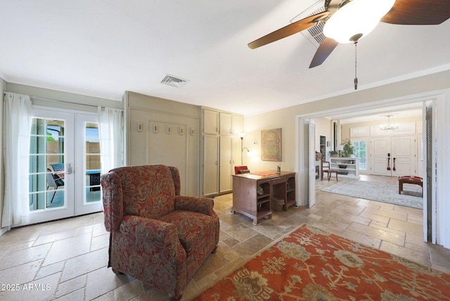 sitting room featuring visible vents, a healthy amount of sunlight, french doors, and stone tile flooring
