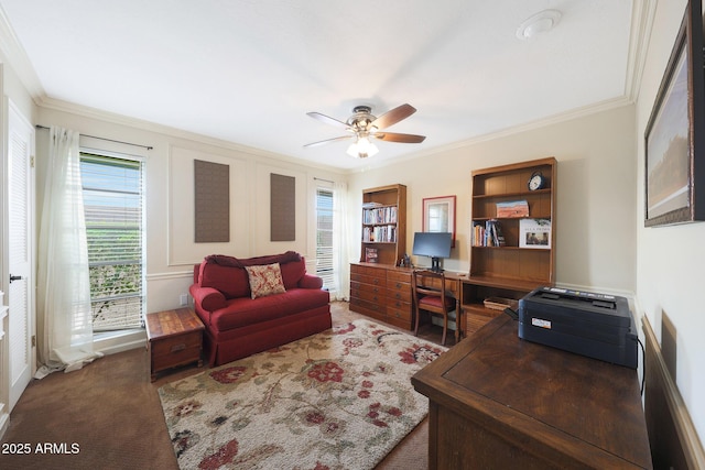 office with carpet flooring, a ceiling fan, and ornamental molding