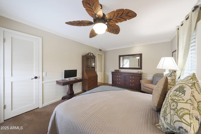 carpeted bedroom featuring baseboards, ornamental molding, and a ceiling fan