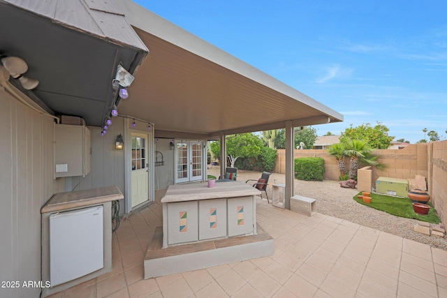 view of patio / terrace featuring a fenced backyard and french doors