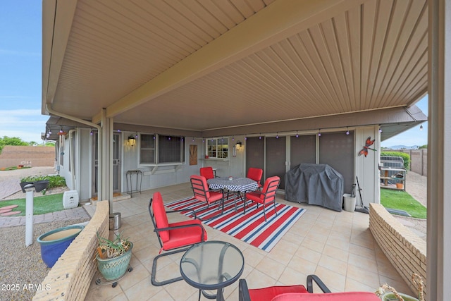 view of patio with fence and grilling area