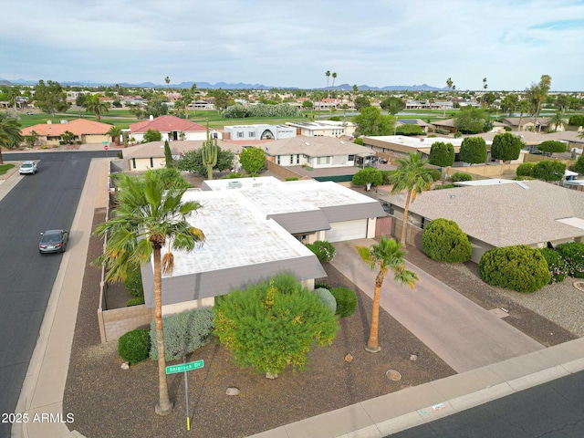 drone / aerial view featuring a mountain view and a residential view