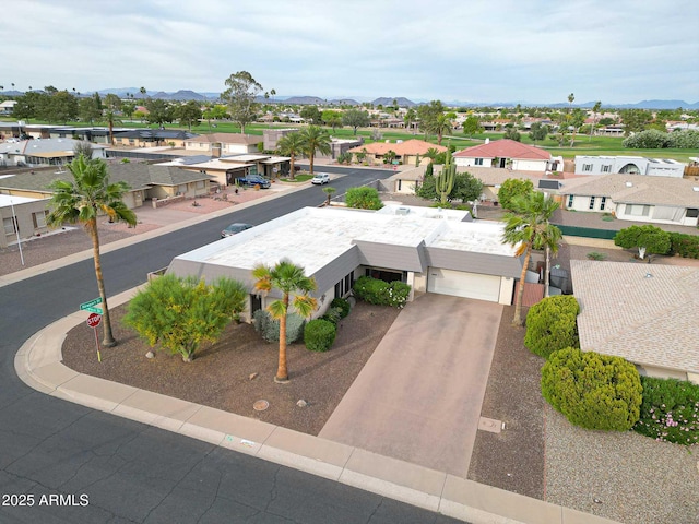 drone / aerial view with a residential view and a mountain view