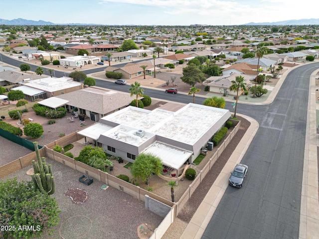 birds eye view of property with a mountain view and a residential view