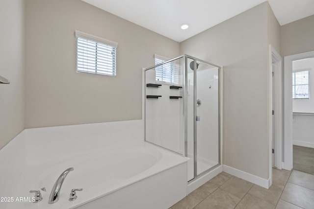 bathroom featuring tile patterned floors, plenty of natural light, and shower with separate bathtub