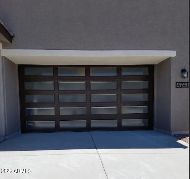 view of exterior entry with a garage