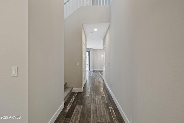 corridor featuring dark hardwood / wood-style floors