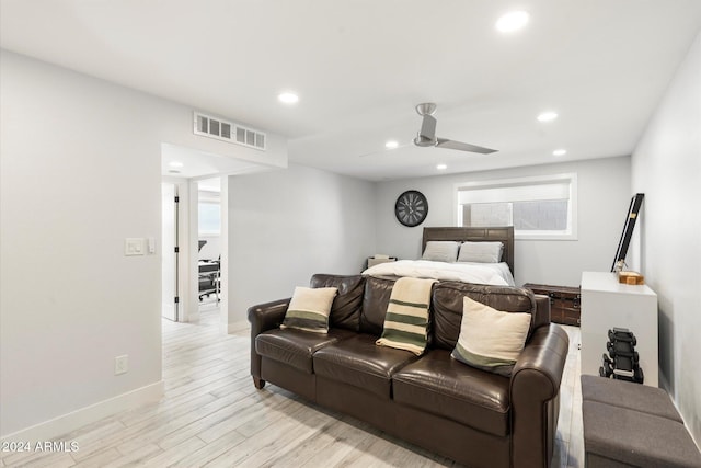 bedroom with ceiling fan and light wood-type flooring