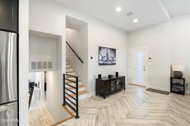 foyer featuring light parquet flooring