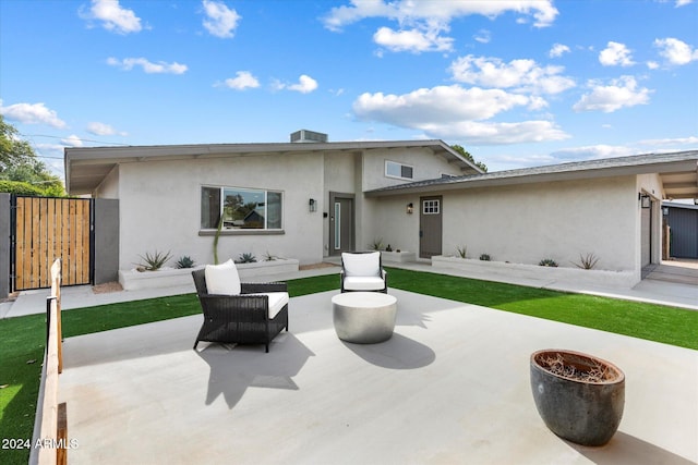 rear view of house featuring a patio area