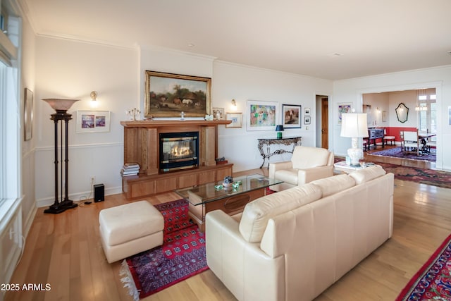 19125 N Lower Territory Rd, Prescott, AZ 86305 - living area featuring light wood finished floors, crown molding, and a glass covered fireplace