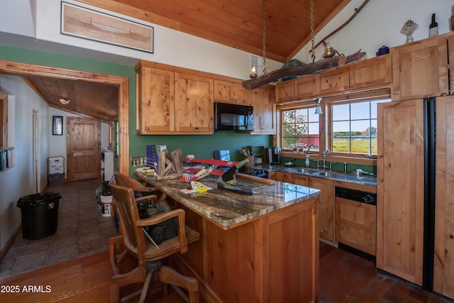 19125 N Lower Territory Rd, Prescott, AZ 86305 - kitchen featuring black microwave, lofted ceiling, wooden ceiling, refrigerator, and a breakfast bar