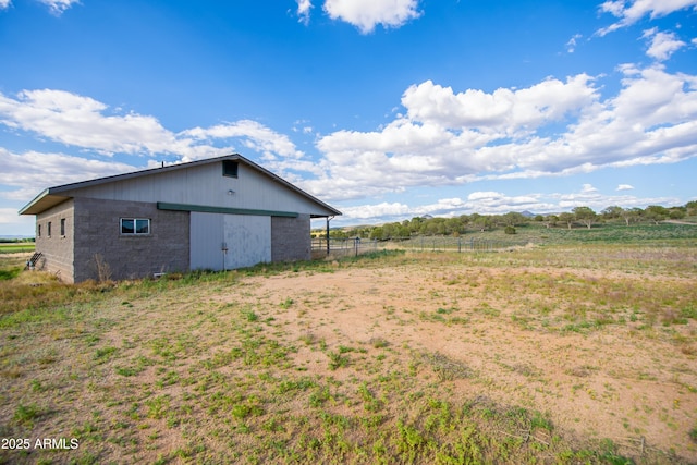 19125 N Lower Territory Rd, Prescott, AZ 86305 - view of side of home with an outdoor structure, a view of countryside, and a pole building