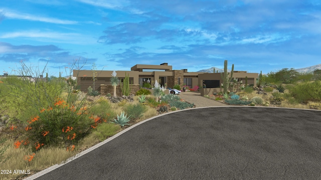 view of front facade featuring stone siding and stucco siding