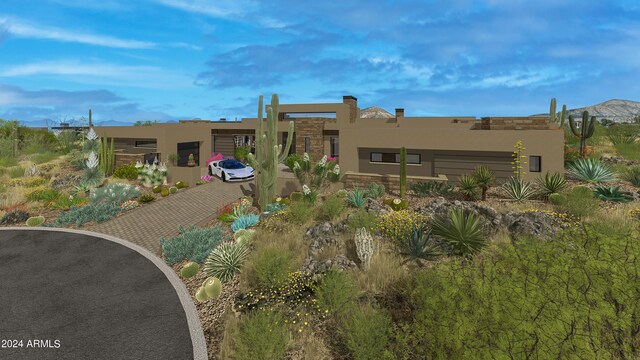 rear view of property featuring a mountain view and stucco siding