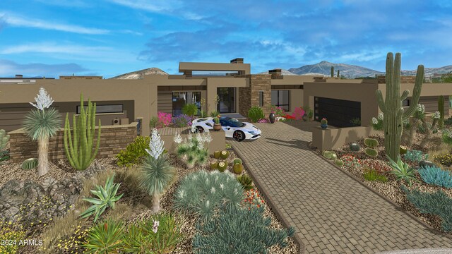 rear view of house featuring a mountain view and stucco siding