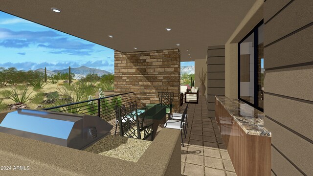 balcony featuring an outdoor living space and a mountain view