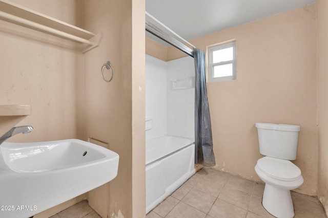 full bathroom with tile patterned floors, toilet, sink, and shower / tub combo