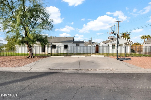 view of front of home featuring basketball court