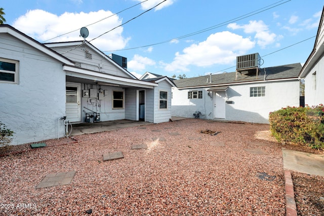 back of house with central AC unit and a patio area