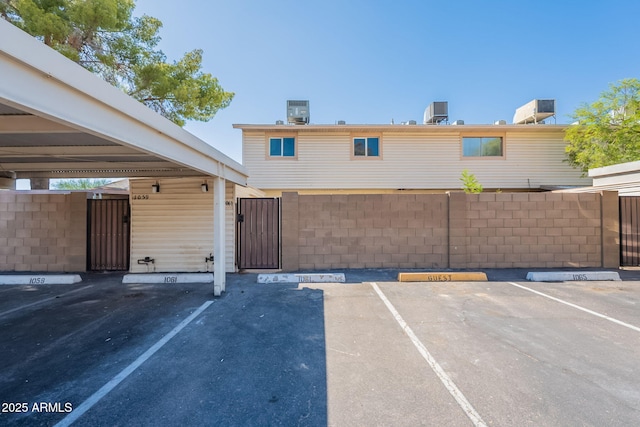 1061 E Fremont Dr, Tempe, AZ 85282 - covered parking lot with a gate