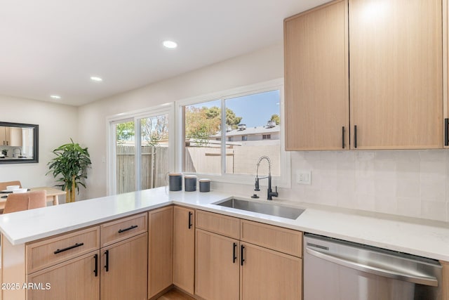1061 E Fremont Dr, Tempe, AZ 85282 - kitchen with stainless steel dishwasher, a peninsula, light brown cabinetry, light countertops, and recessed lighting