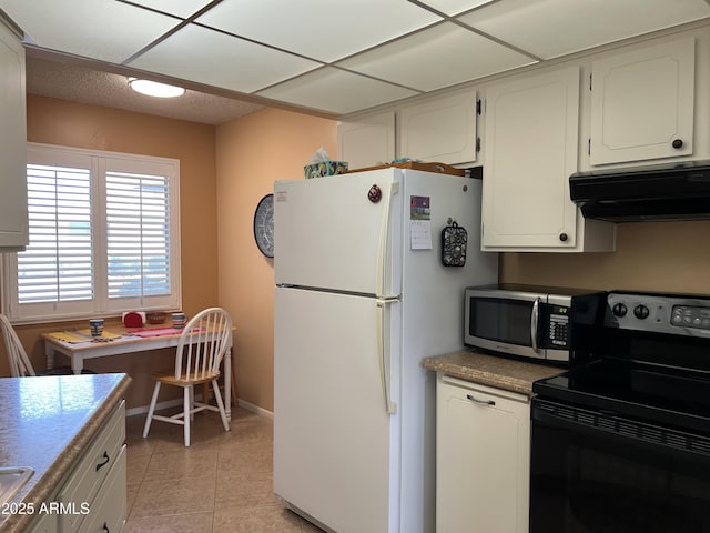 kitchen featuring white cabinetry, light tile patterned floors, electric range, and white refrigerator