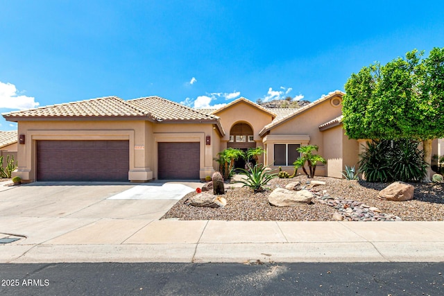 14058 S 24th Way, Phoenix, AZ 85048 - mediterranean / spanish-style house featuring stucco siding, a garage, driveway, and a tile roof
