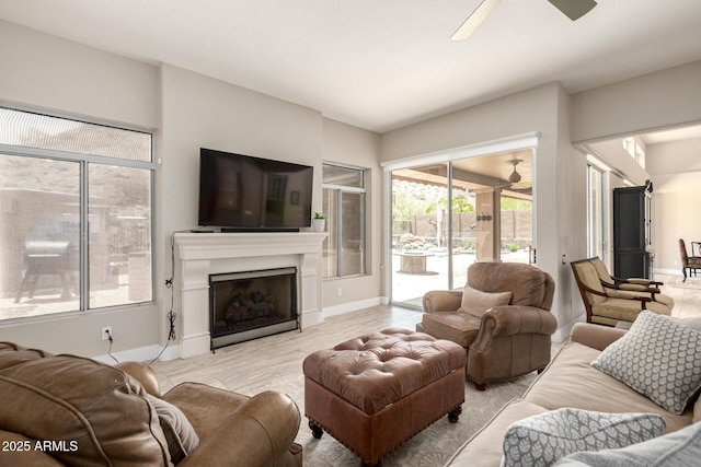 14058 S 24th Way, Phoenix, AZ 85048 - living area featuring a ceiling fan, a fireplace, and wood finished floors