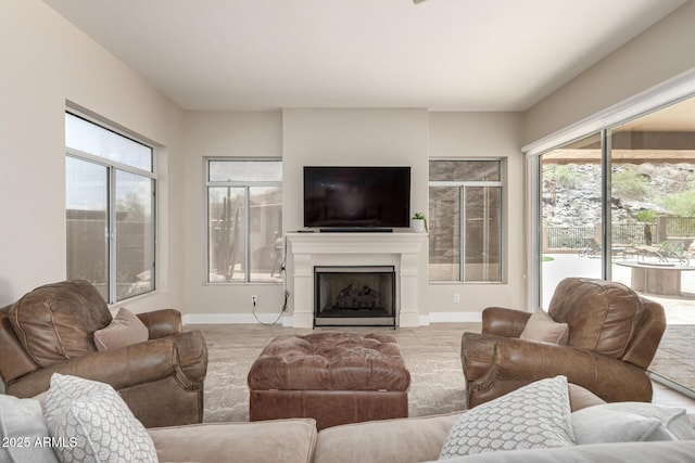 14058 S 24th Way, Phoenix, AZ 85048 - living area featuring a fireplace with flush hearth and baseboards