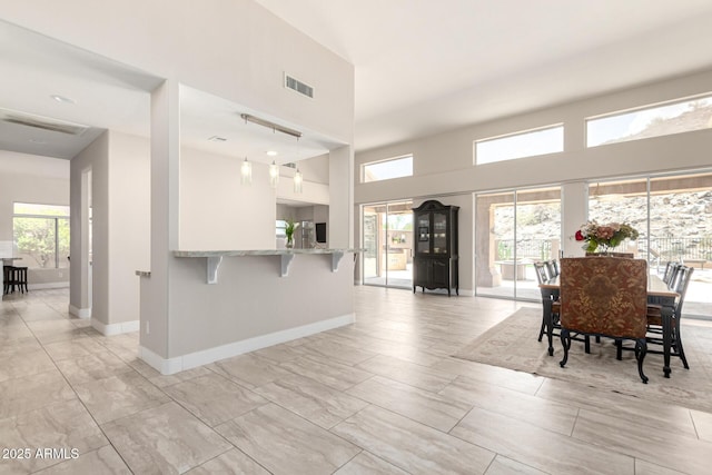 14058 S 24th Way, Phoenix, AZ 85048 - dining room with baseboards and a high ceiling