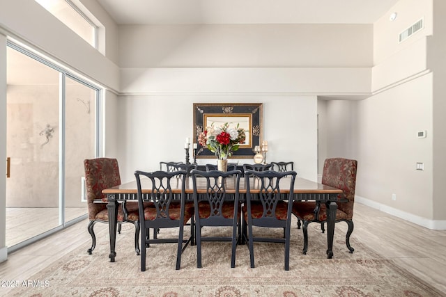 14058 S 24th Way, Phoenix, AZ 85048 - dining room with a high ceiling and baseboards