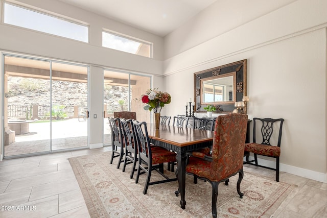 14058 S 24th Way, Phoenix, AZ 85048 - dining space with baseboards and a high ceiling