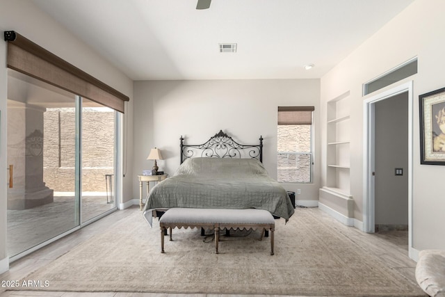14058 S 24th Way, Phoenix, AZ 85048 - bedroom featuring access to exterior, multiple windows, and ceiling fan