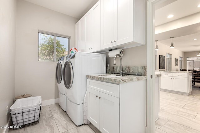 14058 S 24th Way, Phoenix, AZ 85048 - laundry area featuring independent washer and dryer, cabinet space, and recessed lighting