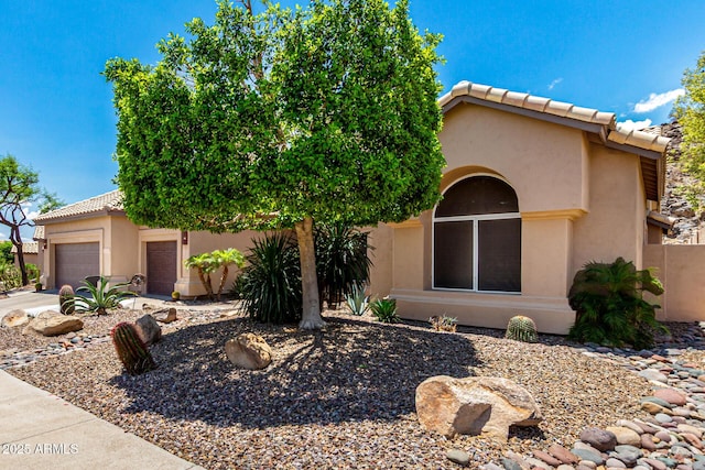 14058 S 24th Way, Phoenix, AZ 85048 - view of front facade with an attached garage, stucco siding, a tiled roof, and concrete driveway