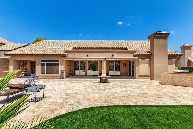 14058 S 24th Way, Phoenix, AZ 85048 - rear view of property with stucco siding, a patio area, a chimney, and a tiled roof