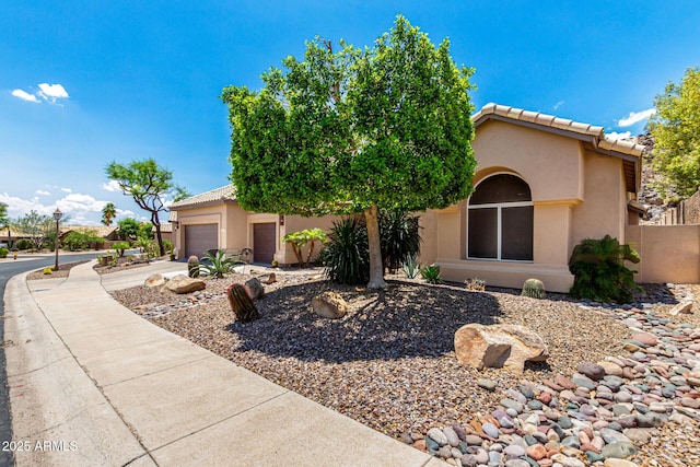 14058 S 24th Way, Phoenix, AZ 85048 - view of front of property with stucco siding, an attached garage, concrete driveway, and a tiled roof