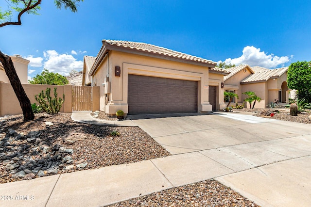 14058 S 24th Way, Phoenix, AZ 85048 - view of front facade with an attached garage, stucco siding, concrete driveway, and a tile roof
