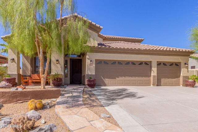 view of front of property with a garage