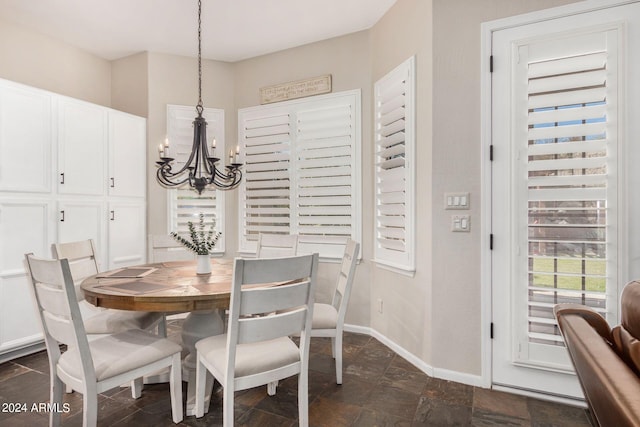 dining area featuring an inviting chandelier