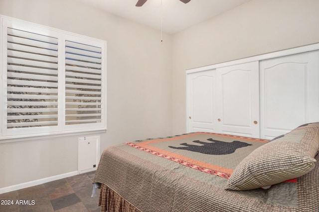 bedroom featuring ceiling fan and a closet