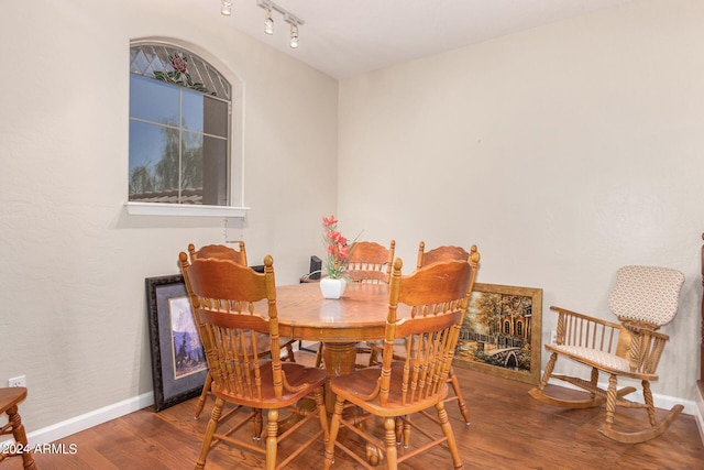 dining area with hardwood / wood-style flooring