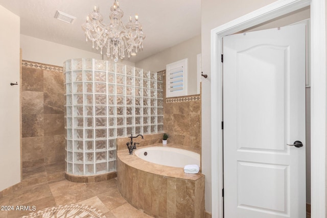 bathroom with independent shower and bath and a chandelier