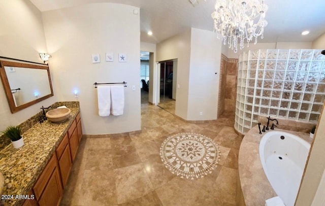 bathroom featuring tile patterned flooring, a chandelier, vanity, and separate shower and tub