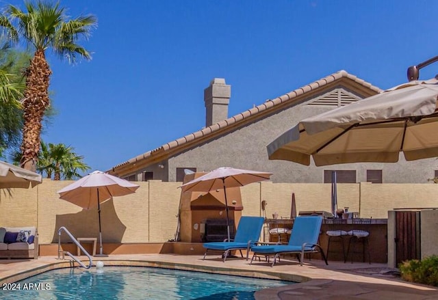 view of swimming pool with a patio area