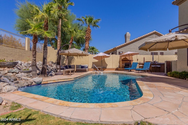 view of swimming pool featuring outdoor lounge area and a patio area