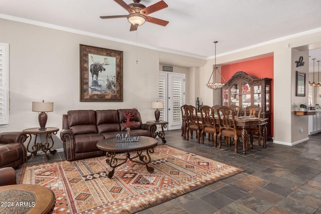 living room with ceiling fan and crown molding