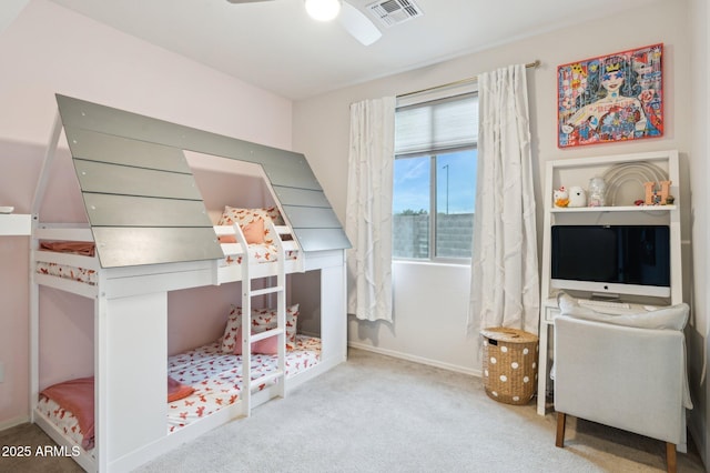 carpeted bedroom with visible vents and baseboards